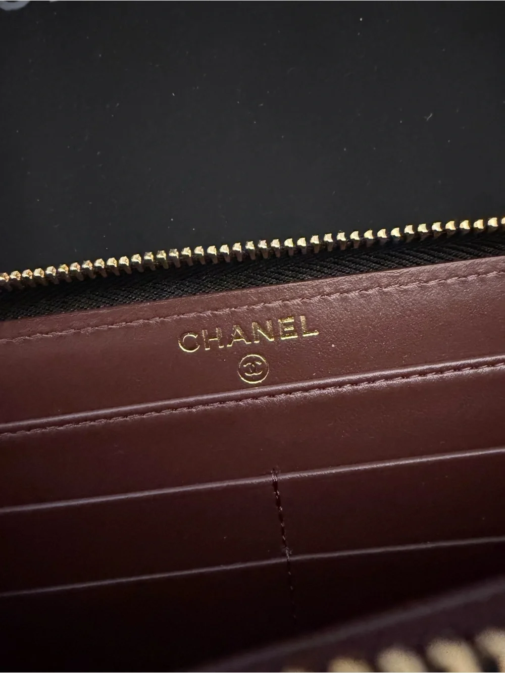 CHANEL Black Quilted Caviar Leather Zip Around Wallet with Gold CC